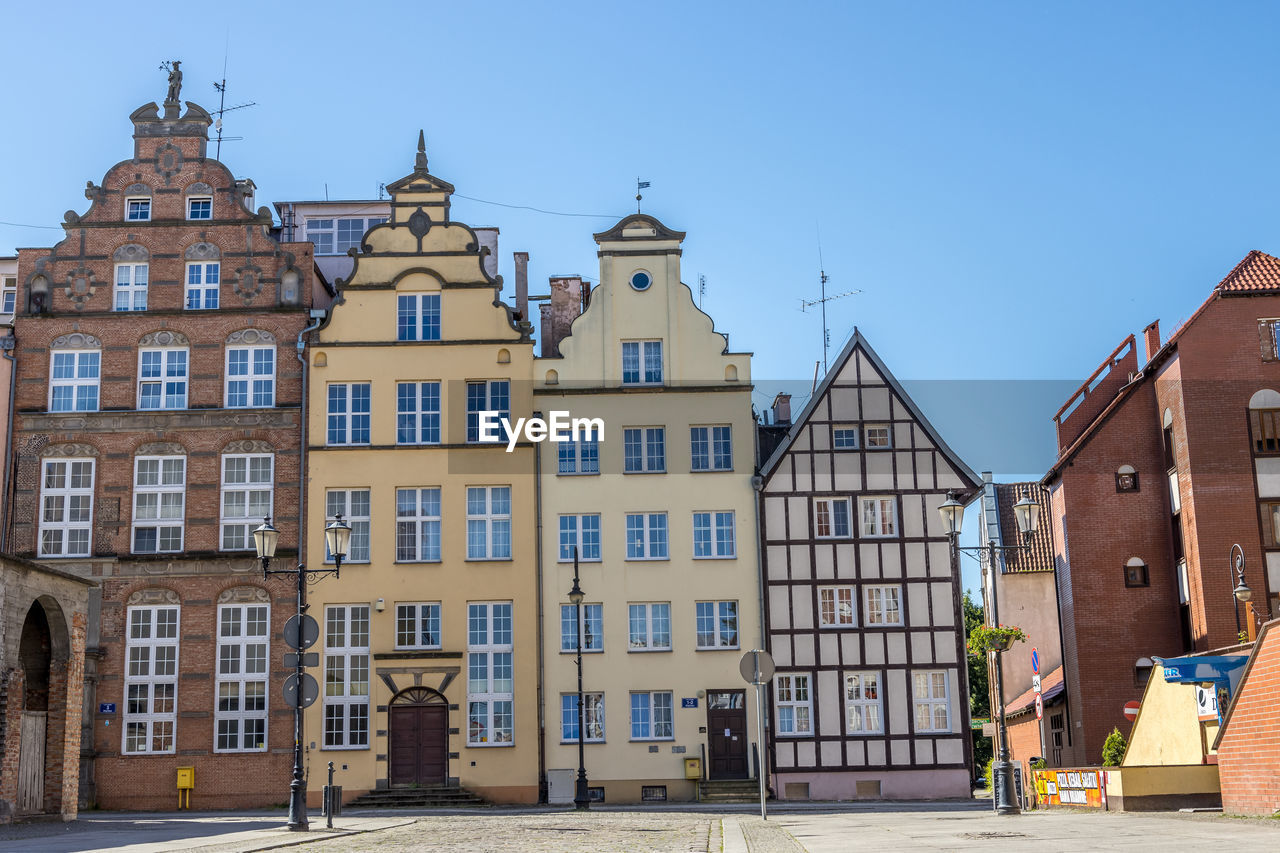Low angle view of buildings in city, the old town in elblag, poland. 