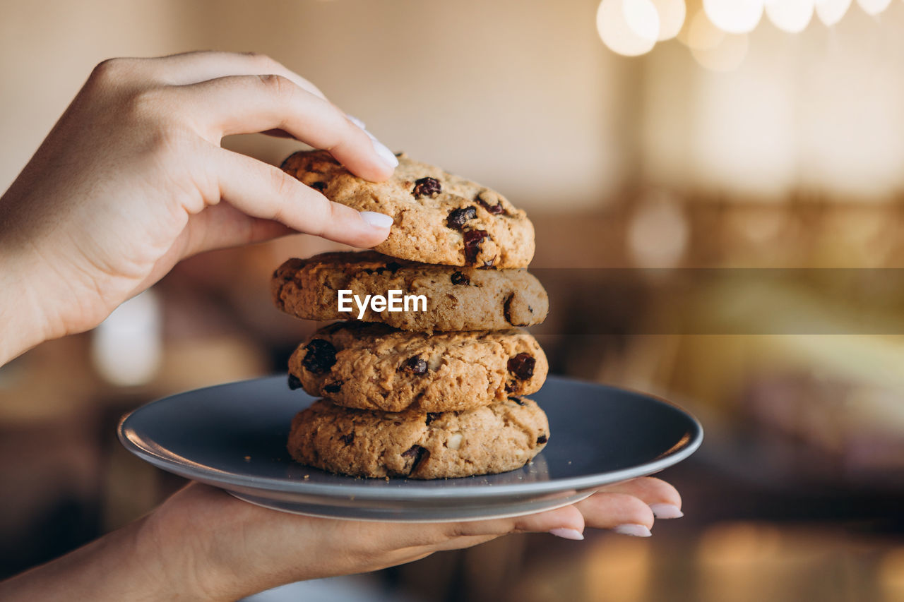 Close-up of hand holding dessert