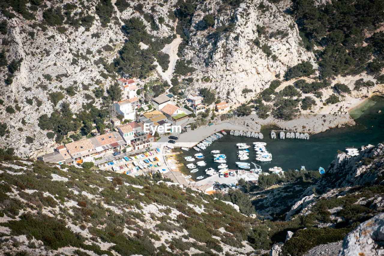 A bird's view unveils a quaint bay and charming harbor. ideal for travel and coastal projects.
