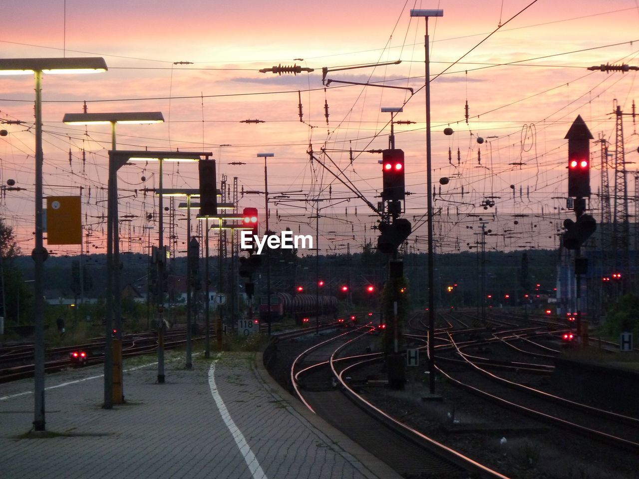 Railroad station platform during sunset