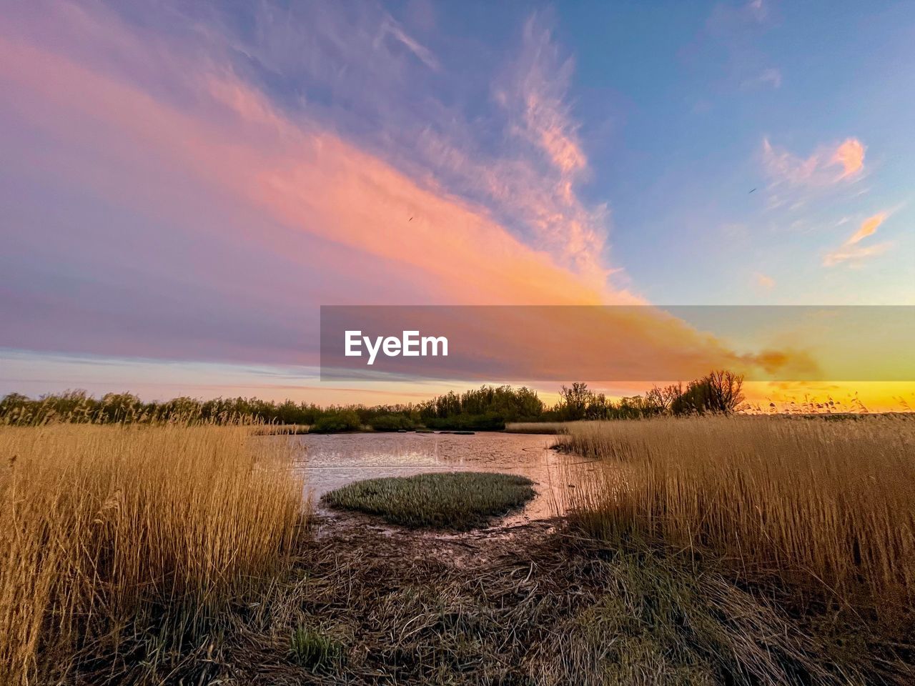 scenic view of landscape against sky during sunset