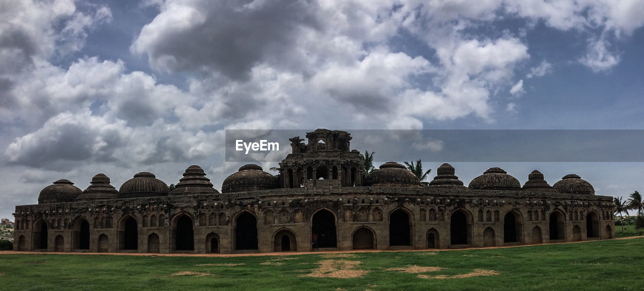 Ruins of building against cloudy sky