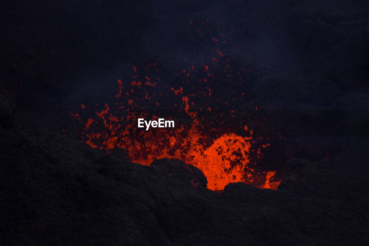 lava, volcano, geology, erupting, heat, power in nature, mountain, no people, land, smoke, nature, active volcano, beauty in nature, molten, environment, sign, night, warning sign, exploding, landscape, communication, physical geography, motion, volcanic landscape, glowing, island, non-urban scene, outdoors, volcanic activity, burning