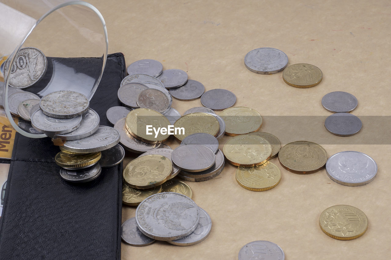 High angle view of coins on table