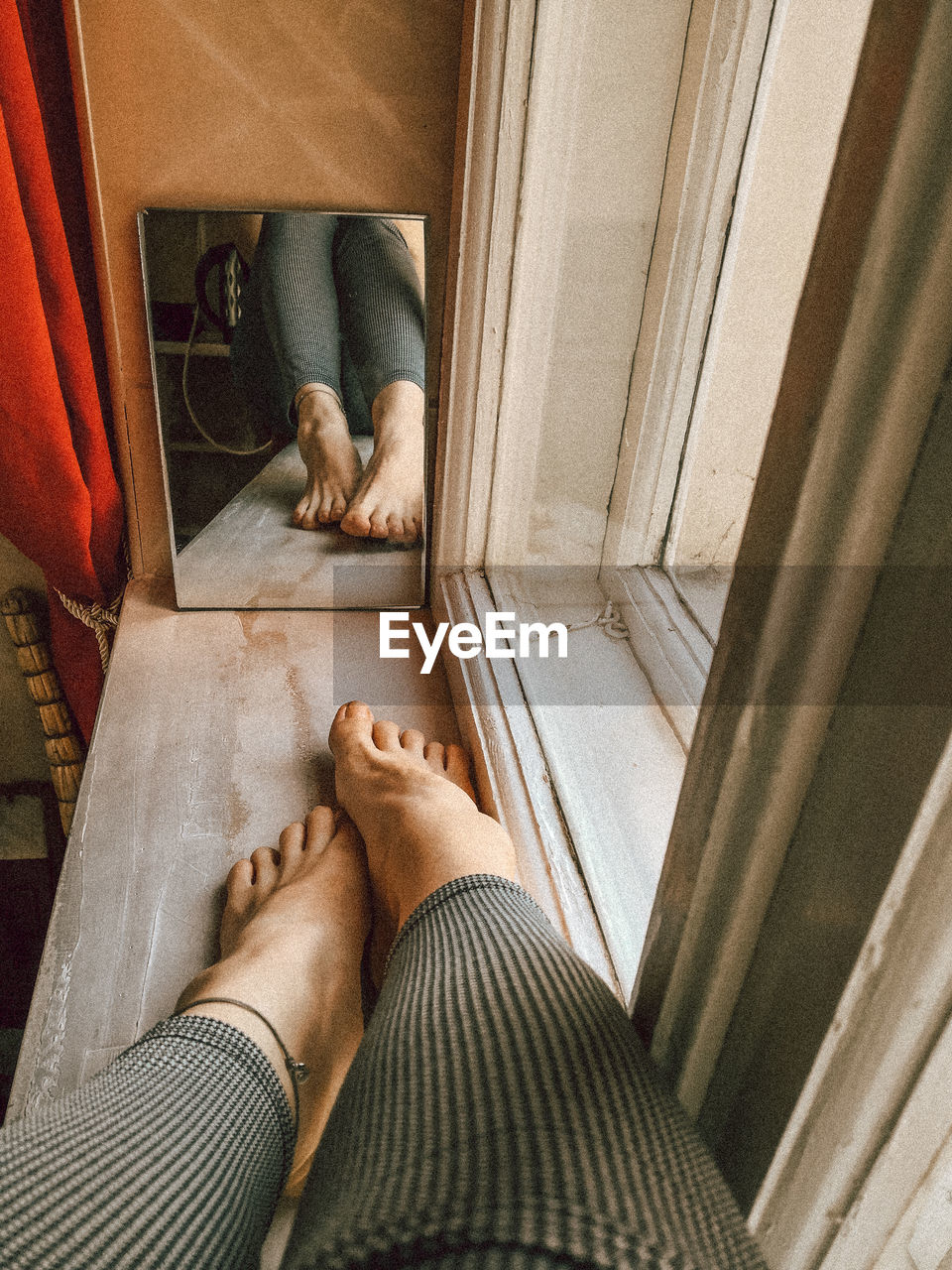 Low section view of girl relaxing at home