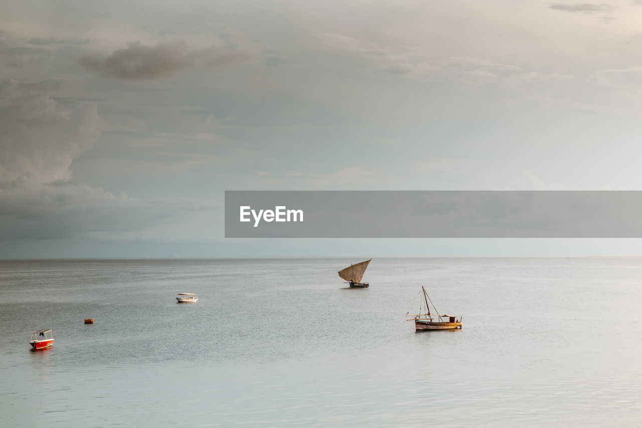 Scenic view of sailboat in sea against sky