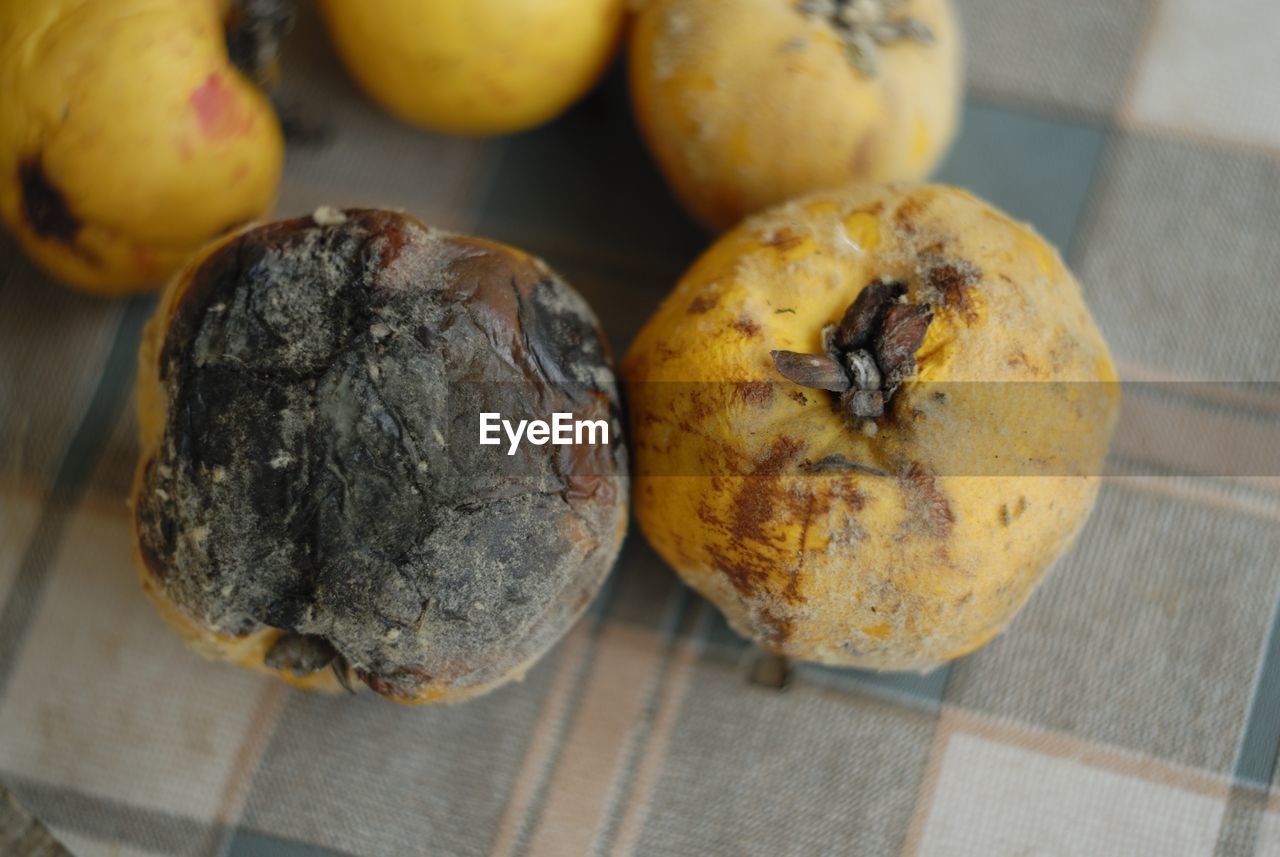 High angle close-up of rotten fruits on table