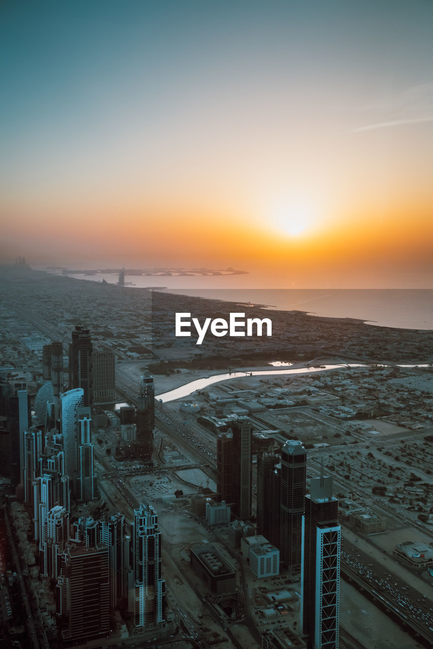 High angle view of cityscape against sky during sunset