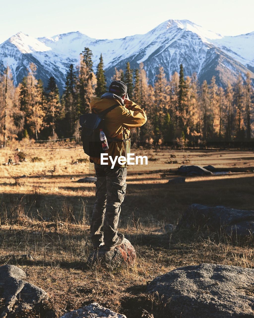 Rear view of man standing on landscape