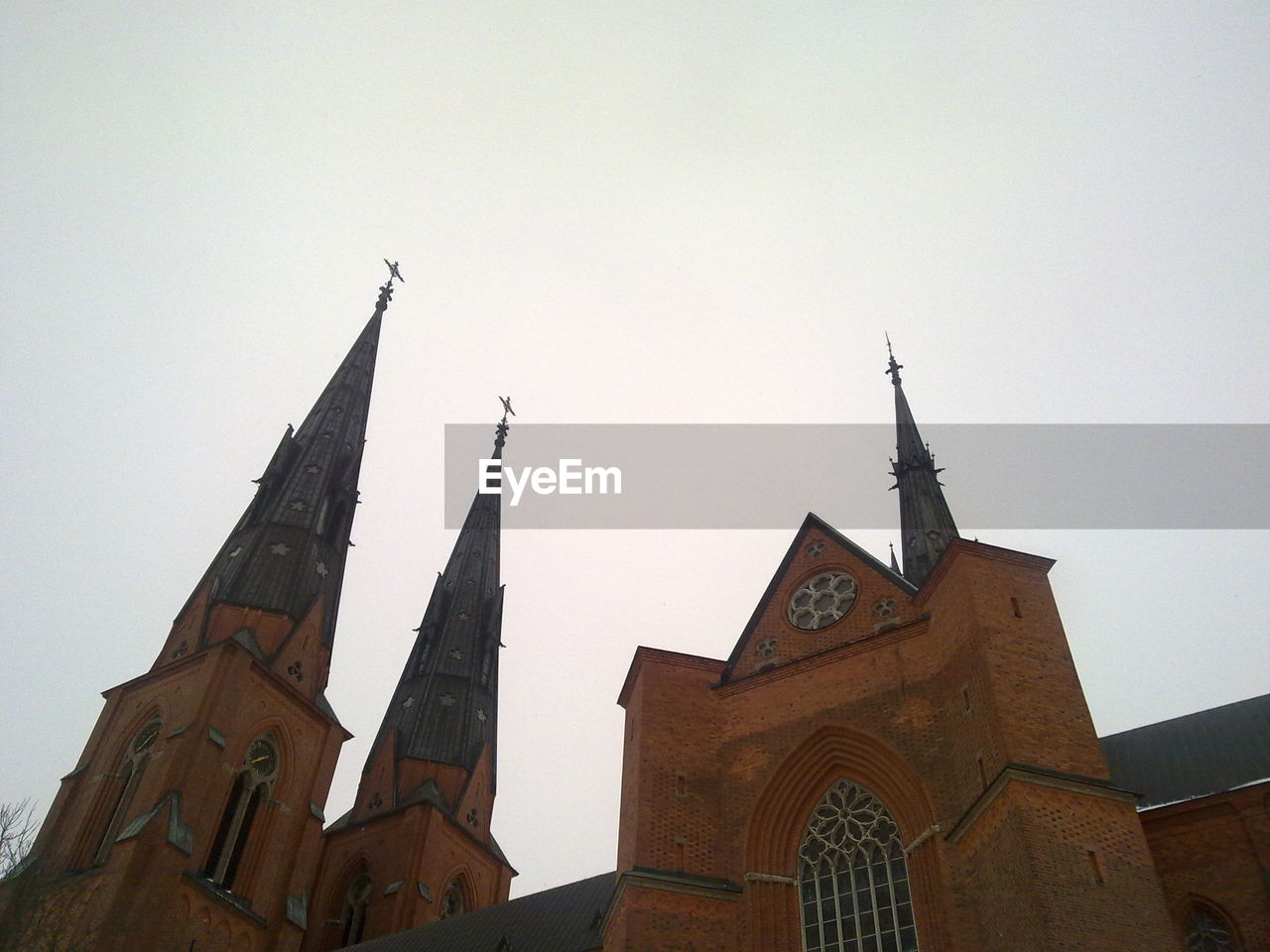 Low angle view of uppsala cathedral against clear sky