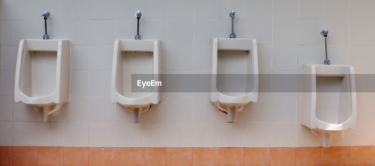 Urinals in public restroom