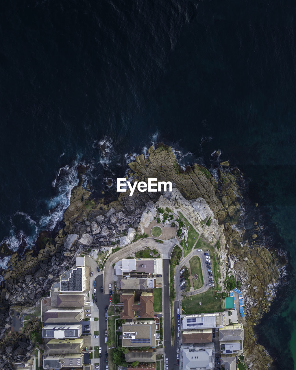 Aerial view of buildings by sea