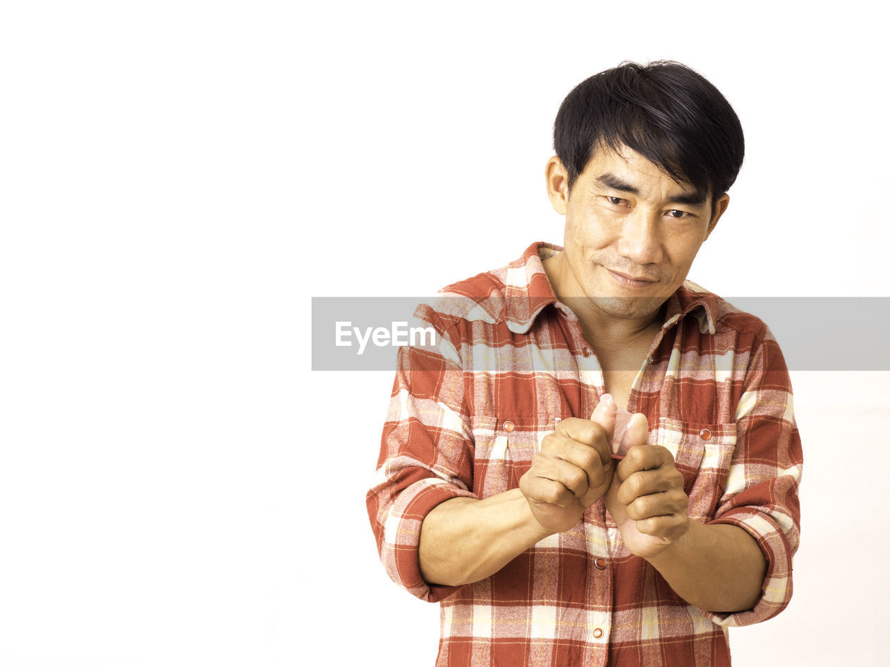 PORTRAIT OF YOUNG MAN AGAINST WHITE BACKGROUND