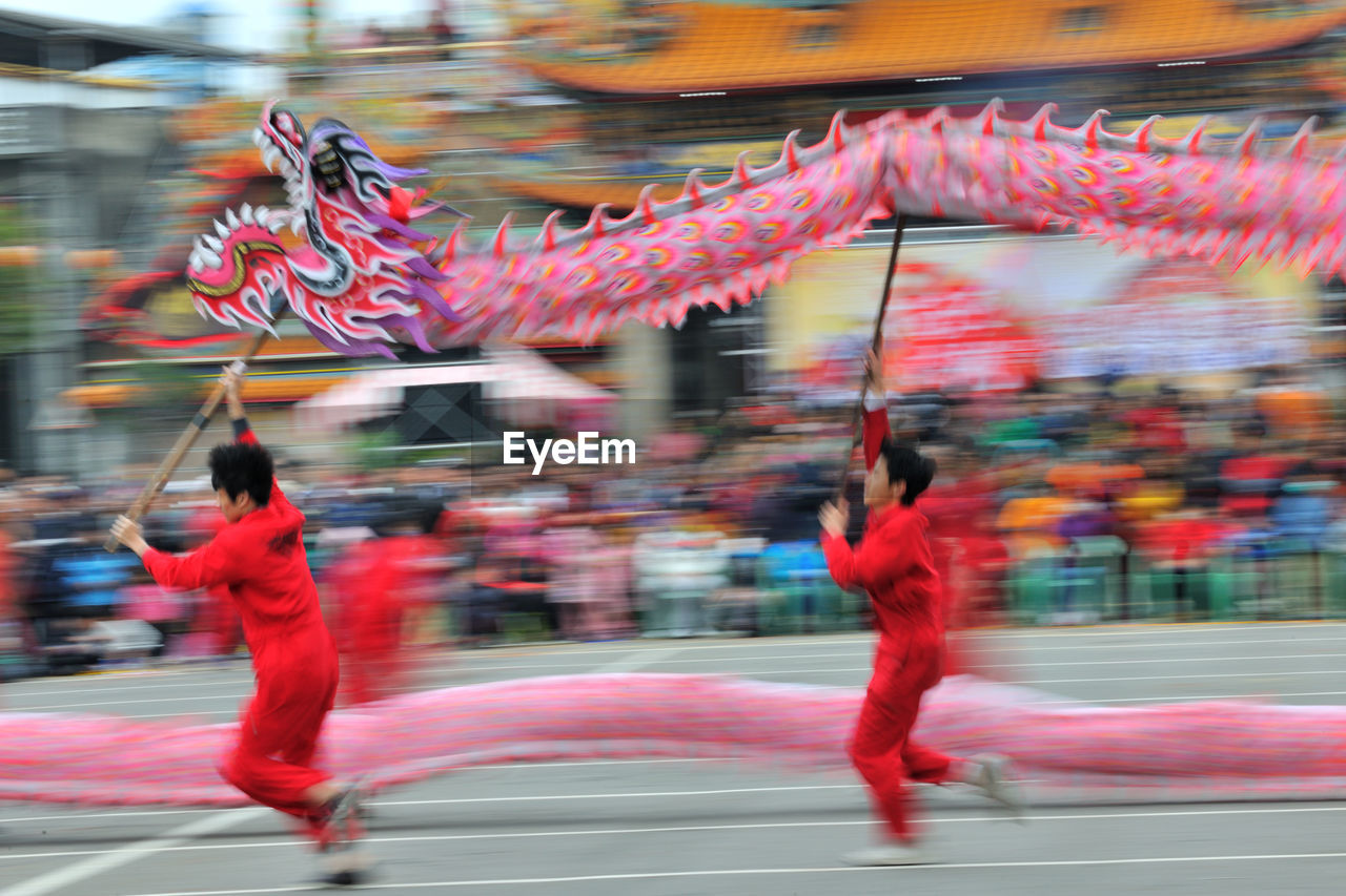 FULL LENGTH OF MAN DANCING IN MID-AIR