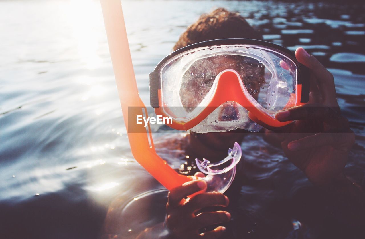 Close-up of man swimming in sea