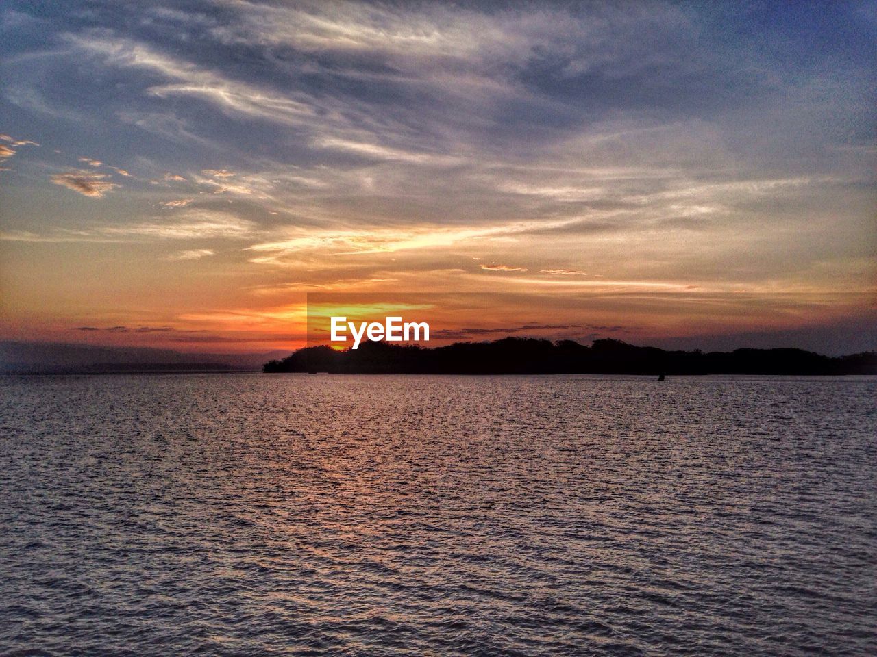 Scenic view of sea at sunset