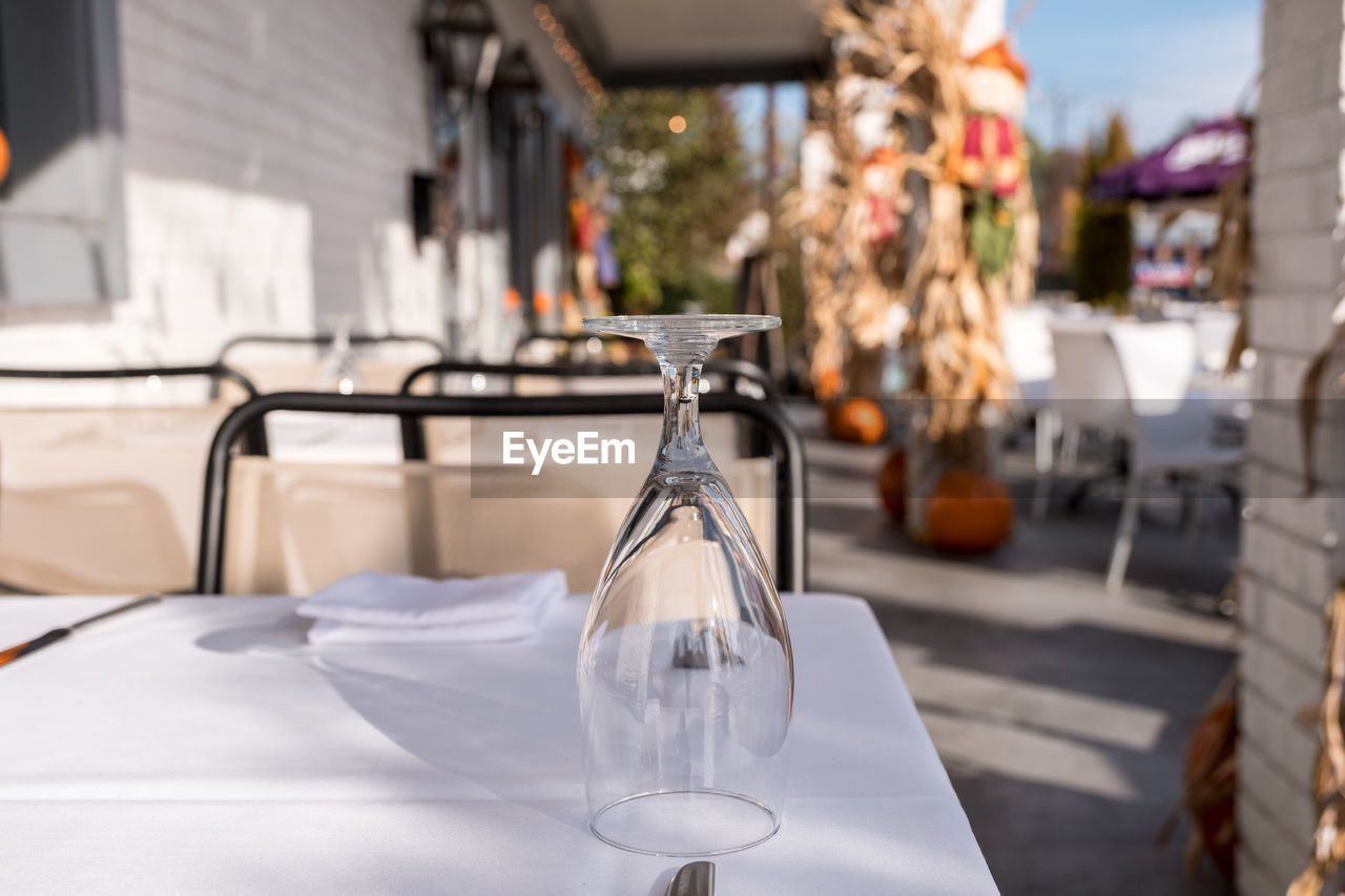 Close-up of wineglass on table at sidewalk cafe