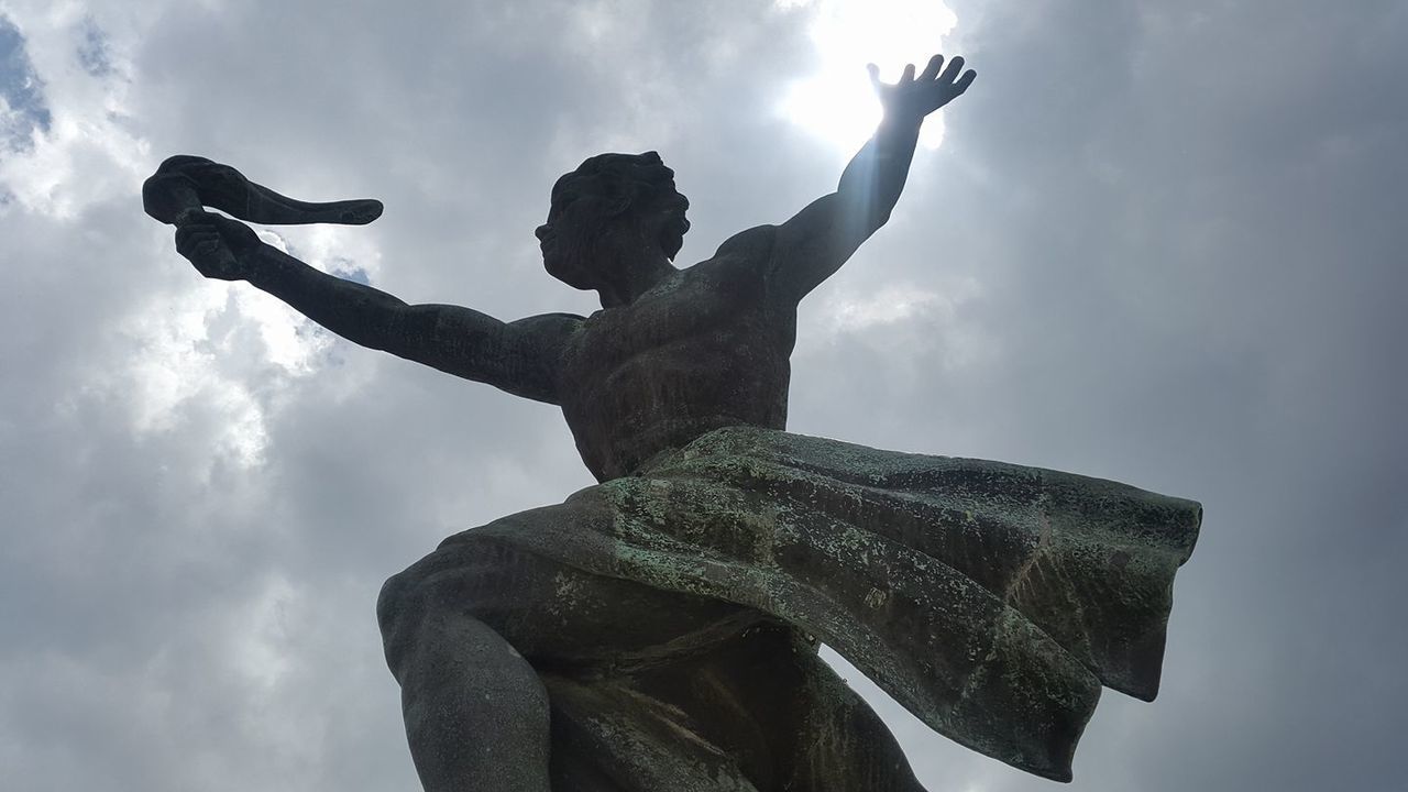 sky, cloud, statue, monument, sculpture, art, nature, low angle view, silhouette, adult, human representation, arm, outdoors, architecture, representation, creativity, one person, person