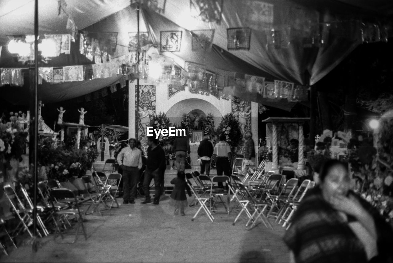 GROUP OF PEOPLE AT RESTAURANT