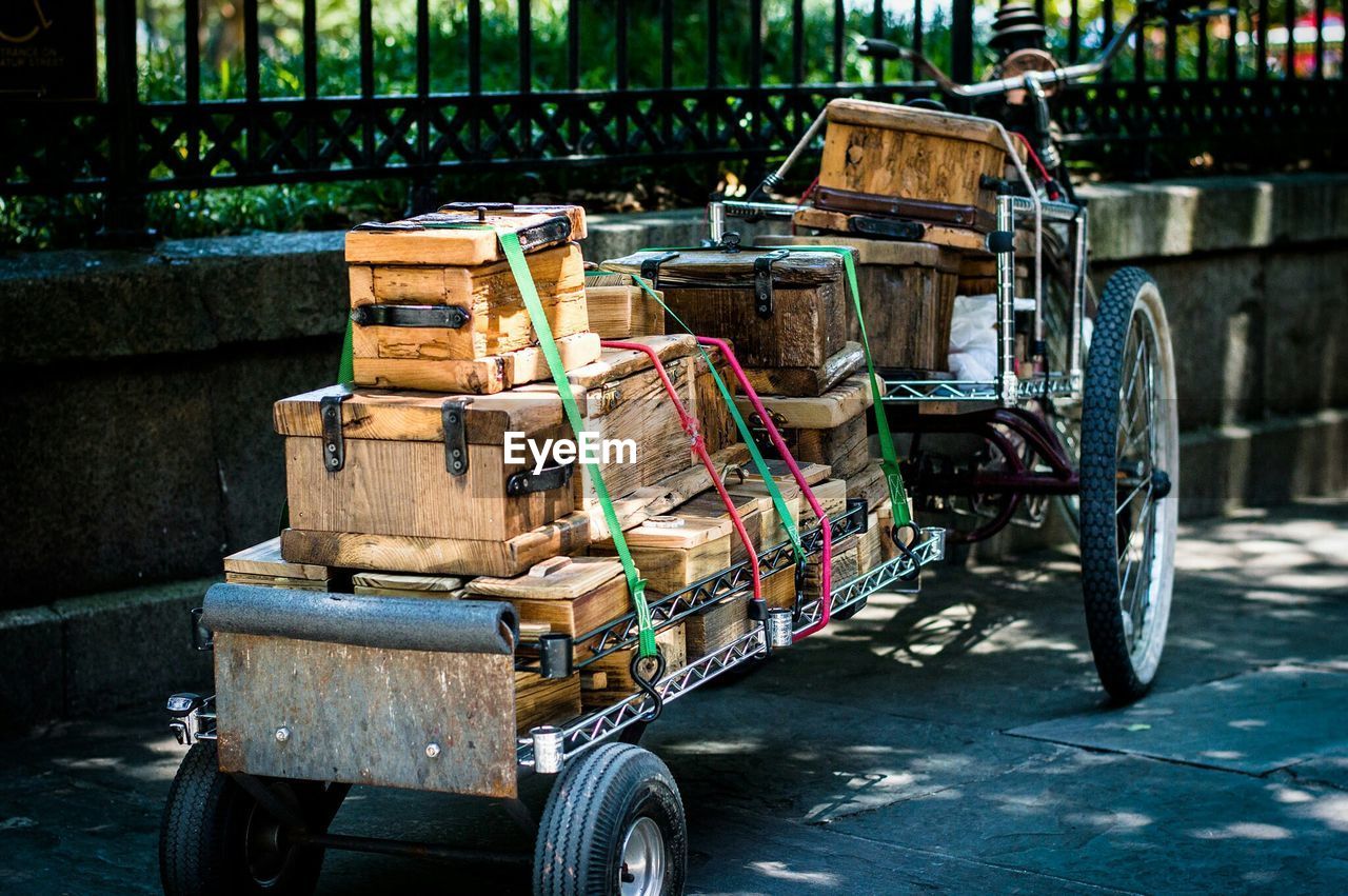 Stack of wooden boxes on trailer at street