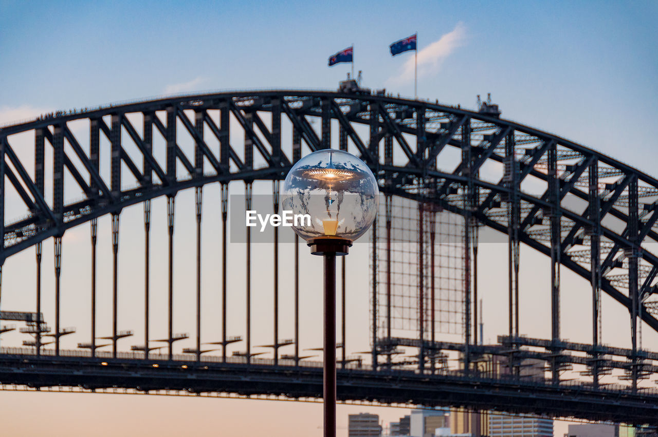 Street gas lighting against sydney harbour bridge on the background. sydney, australia