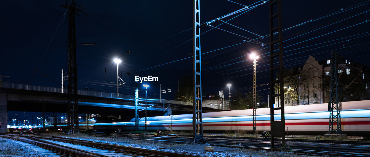 RAILROAD TRACKS AT NIGHT