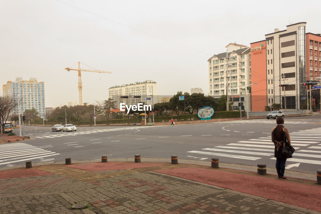 PEOPLE ON STREET IN CITY