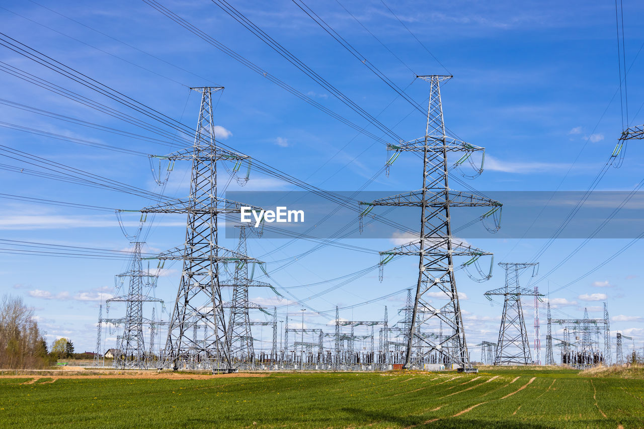 High voltage electricity pylons, transmission power lines, and distribution substations