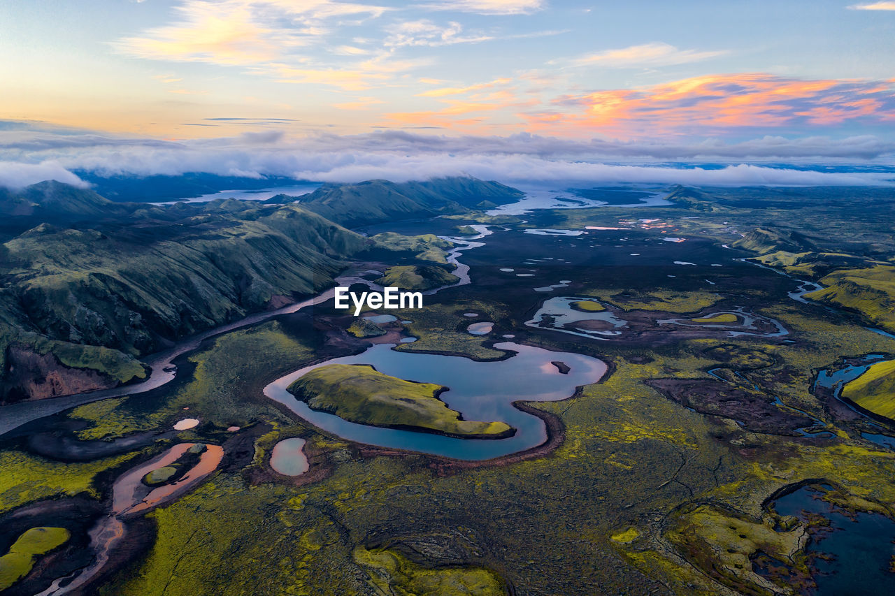 Aerial view of landscape against sky during sunset