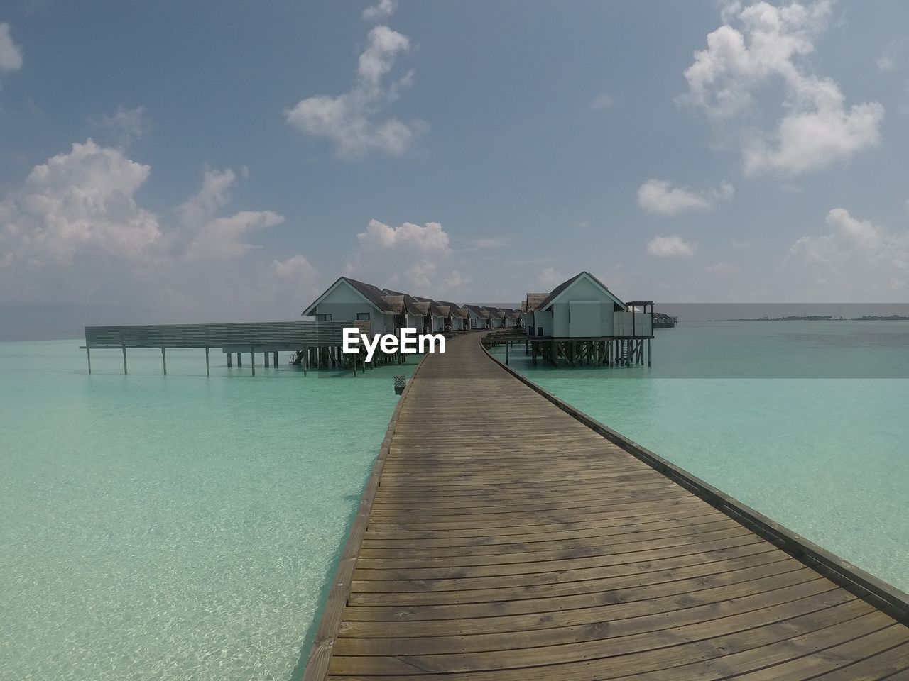 Pier over sea against sky