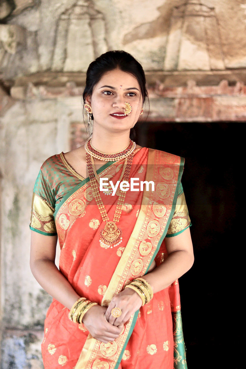 Young woman wearing sari looking away