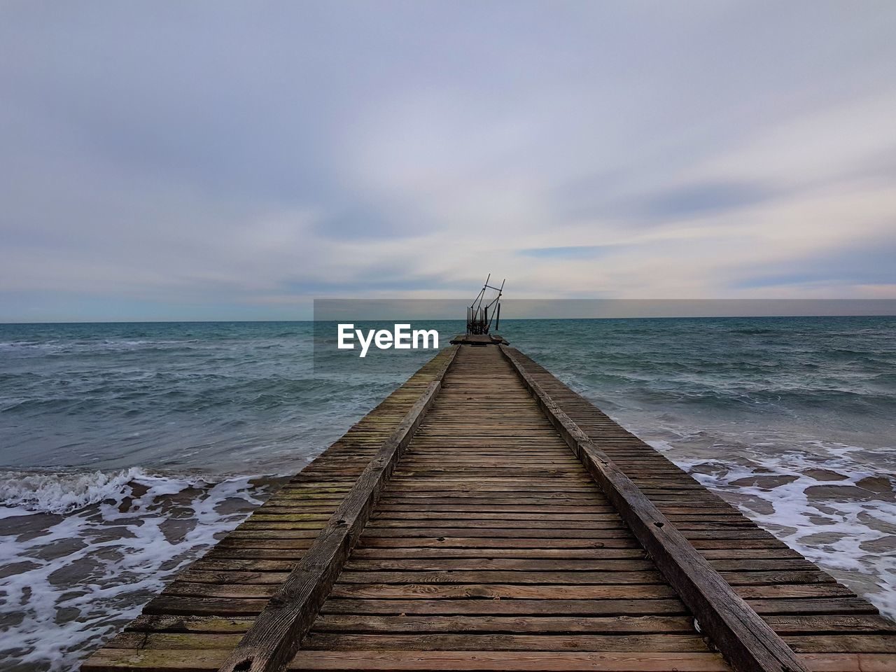 VIEW OF PIER ON SEA AGAINST SKY