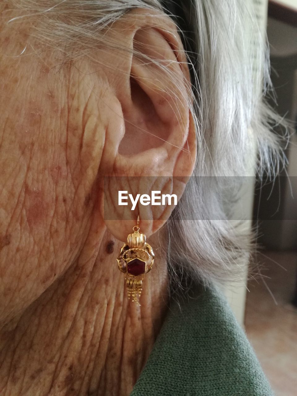 Close-up of woman ear with jewelry