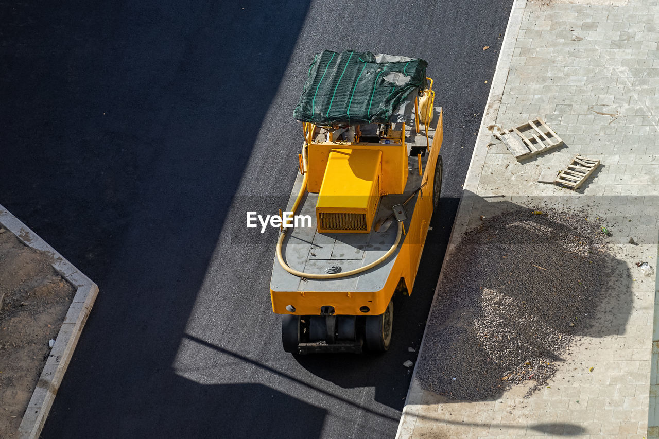 Pneumatic tire roller. construction road machinery at work . top view.