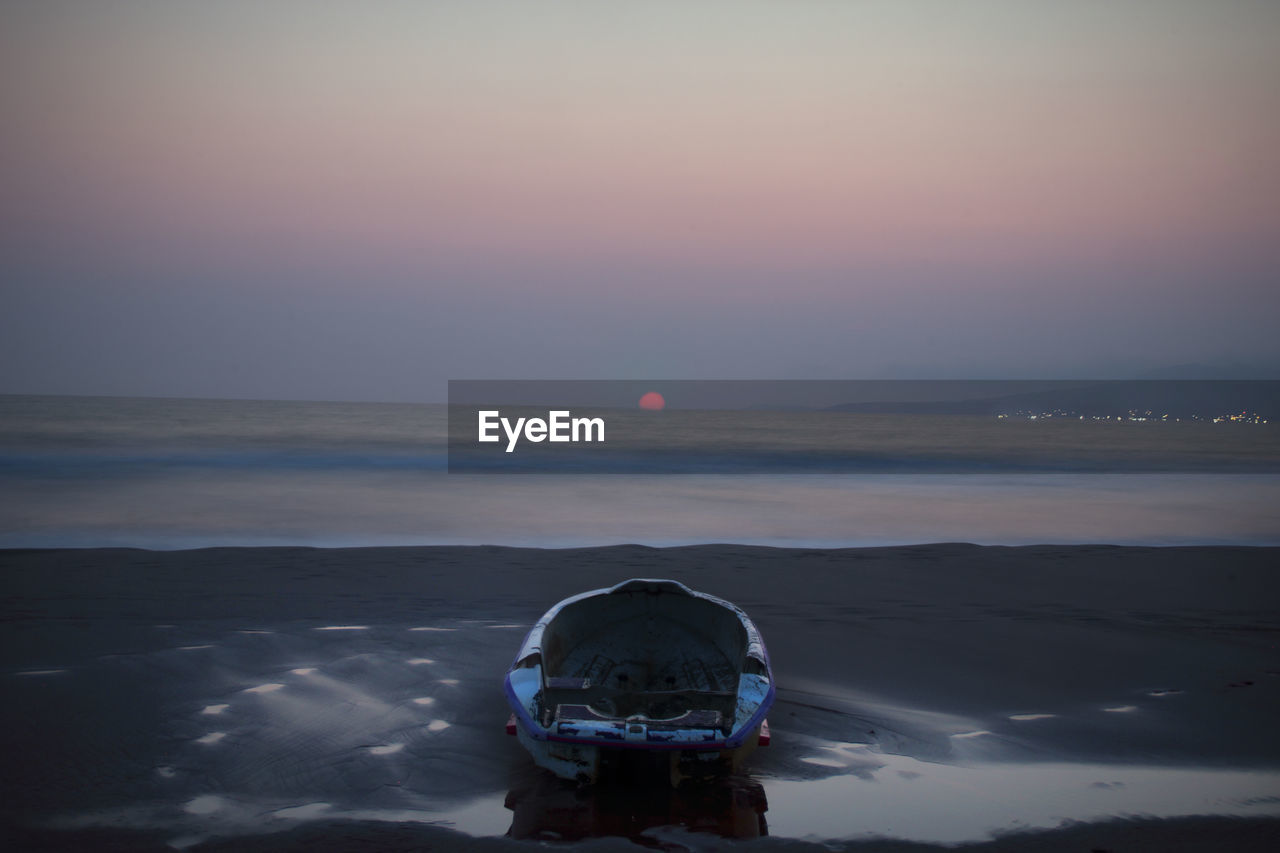 Scenic view of sea against sky at sunset