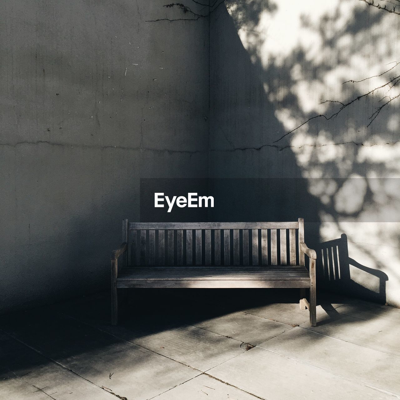 Empty bench in corner