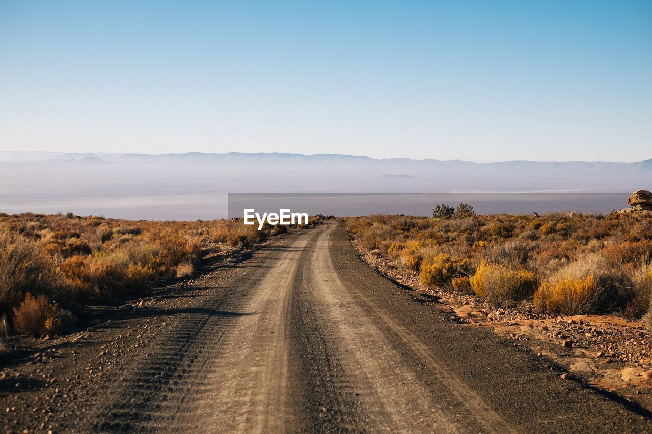 Road amidst landscape against sky