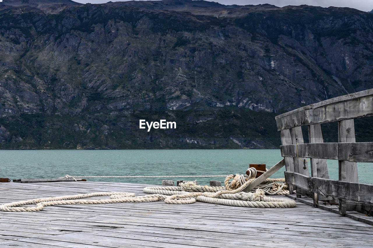 Scenic view of sea by mountain