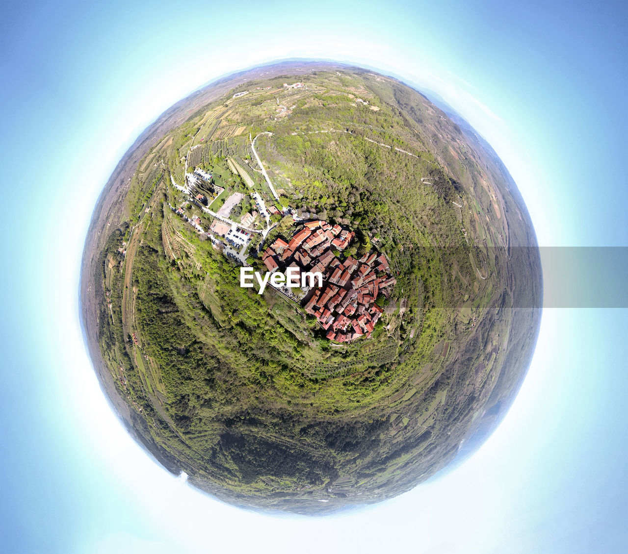 Little planet effect of houses on field