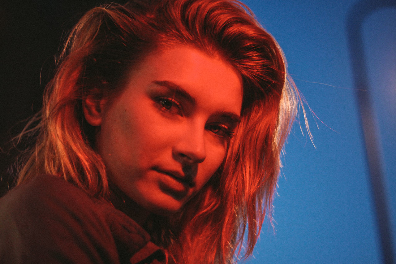 CLOSE-UP OF BEAUTIFUL YOUNG WOMAN WITH HAIR