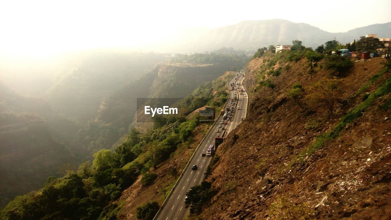 Scenic view of highway surrounded by landscape