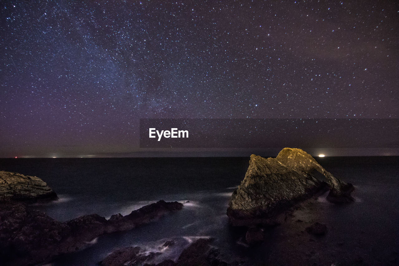 Scenic view of lake at night