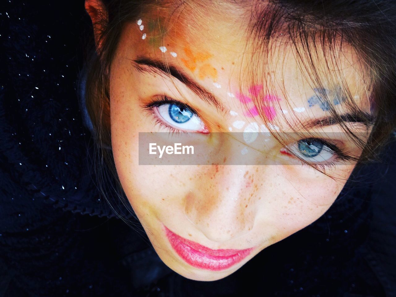 Close-up portrait of girl with face paint