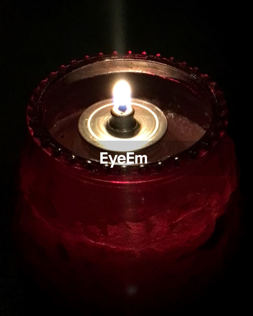 LOW ANGLE VIEW OF LIT CANDLE