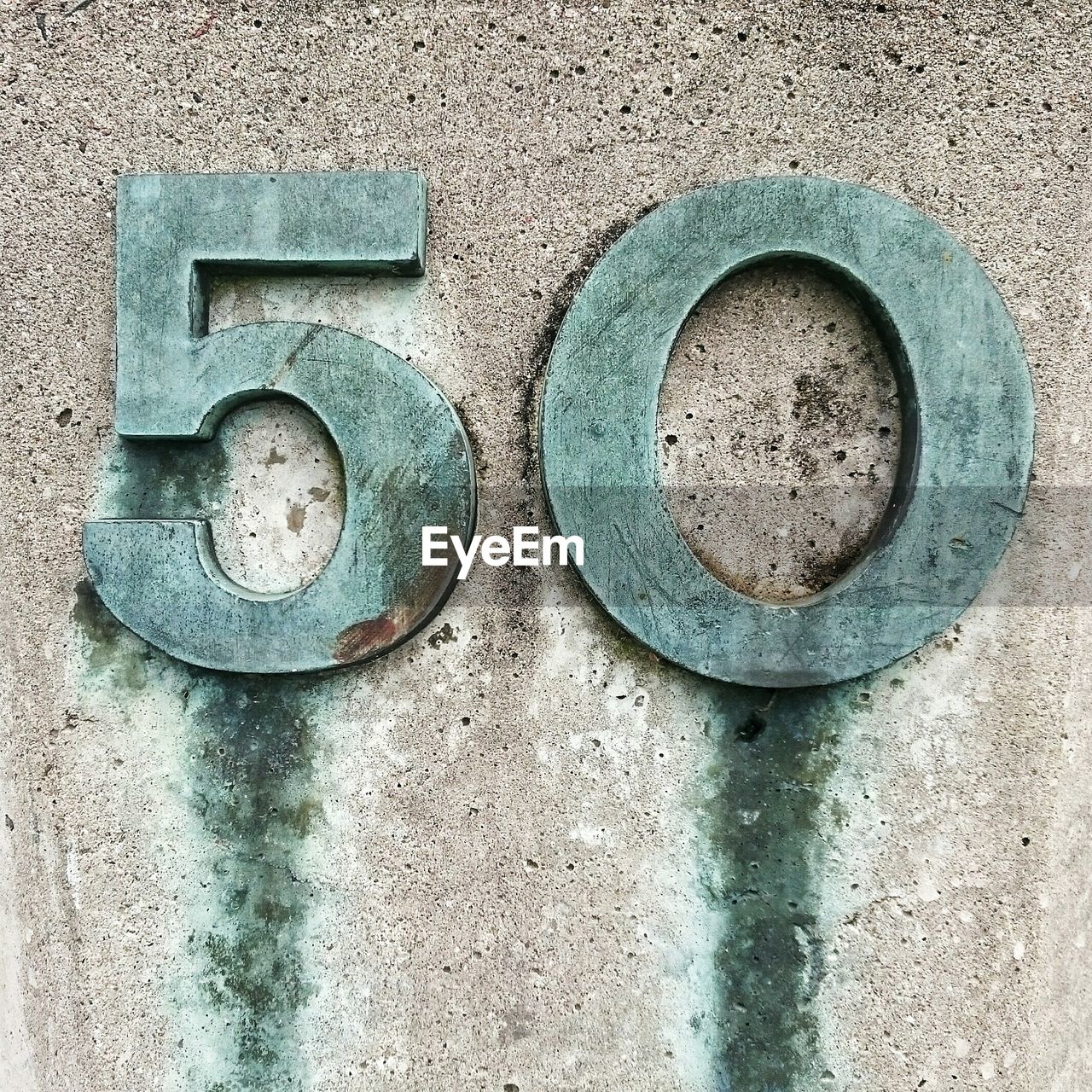 Number 50 on concrete wall