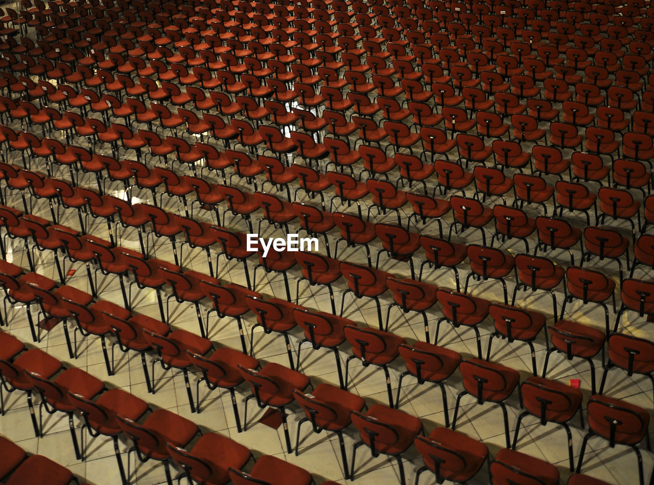 High angle view of red empty chairs