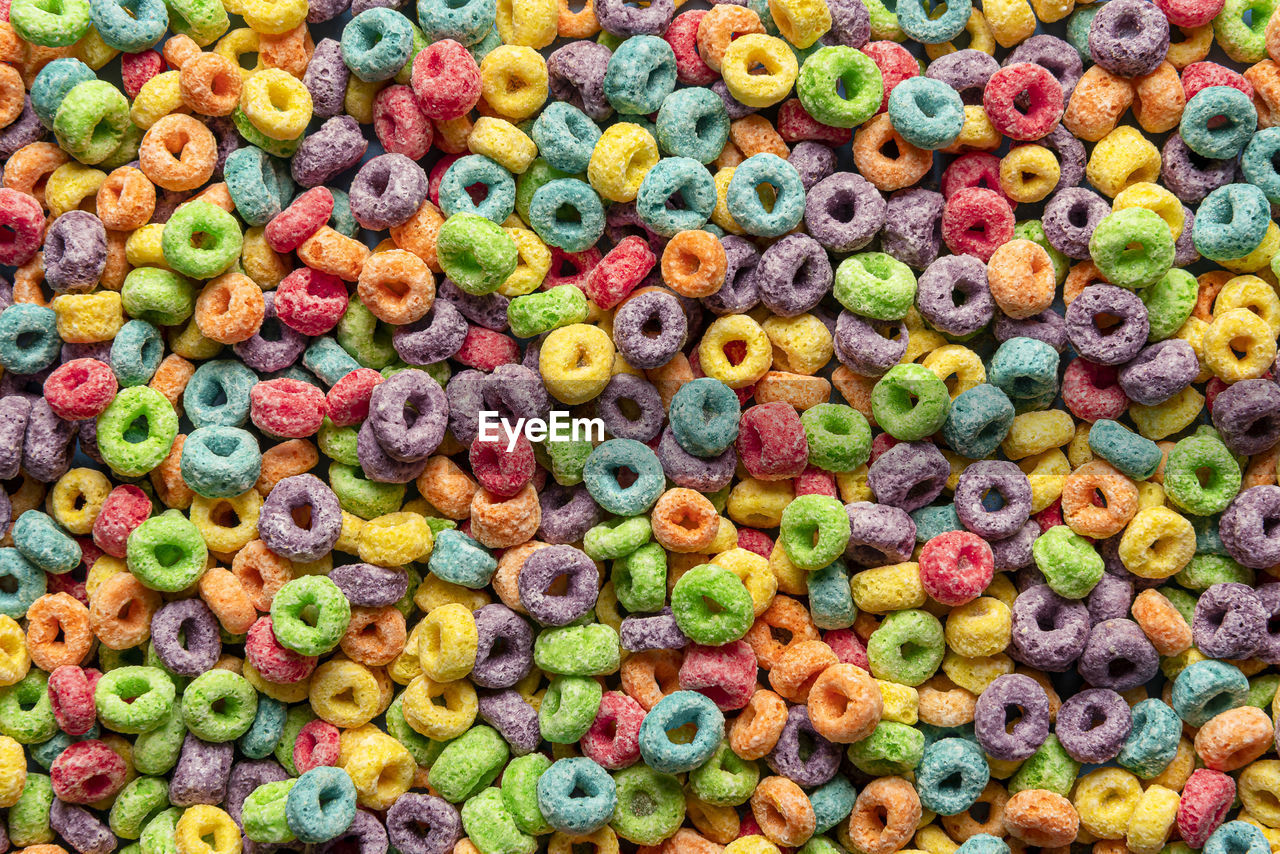 Multicolored cereals, full-frame. top view colorful breakfast cereals. backdrop of multigrain cereal