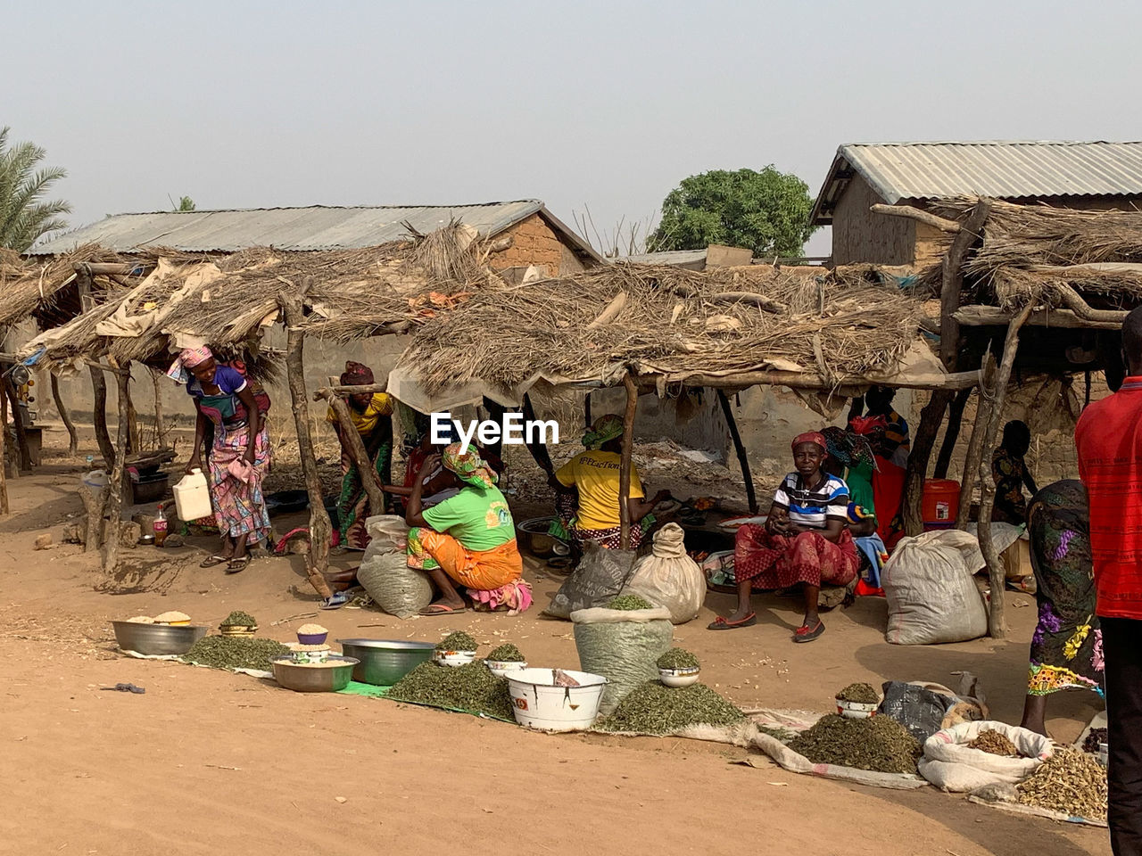 GROUP OF PEOPLE OUTSIDE HOUSE