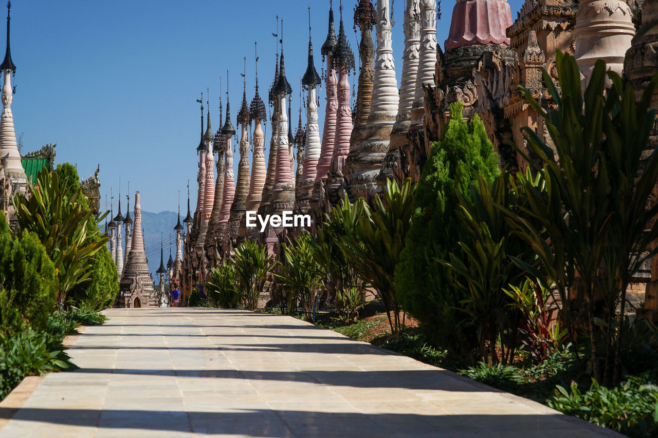 Footpath amidst stupas in kakku pagoda complex, myanmar
