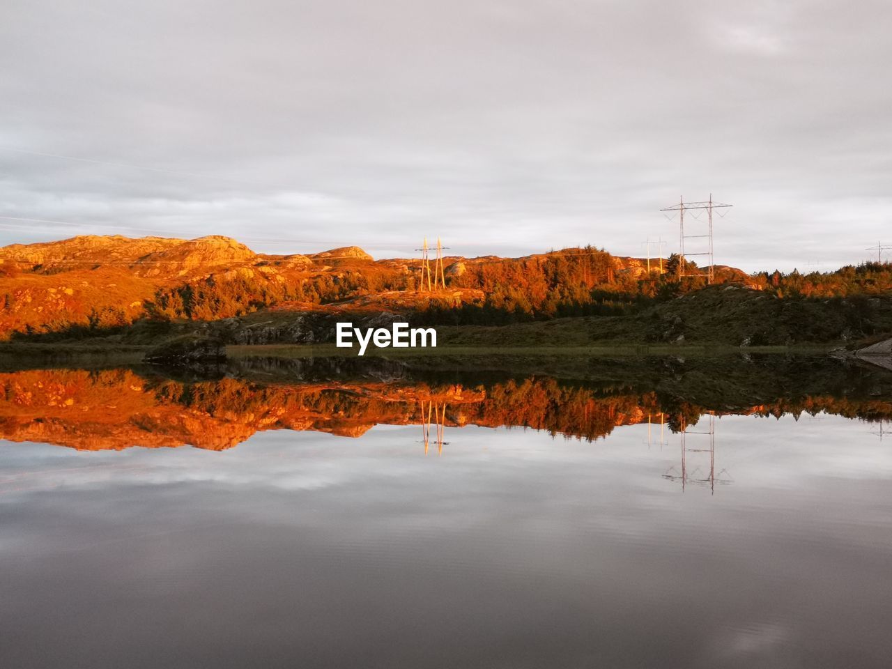 Scenic view of lake against sky during autumn